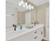 Bathroom featuring double sinks with modern fixtures, a large mirror, and ample counter space at 12006 Glenshire Dr, Riverview, FL 33579