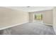 Spacious bedroom with large windows and neutral carpeting at 12006 Glenshire Dr, Riverview, FL 33579