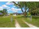 Home exterior with fenced front yard and mature trees at 12006 Glenshire Dr, Riverview, FL 33579