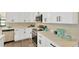 Modern kitchen featuring sleek white cabinets, stainless steel appliances, and quartz countertops at 12006 Glenshire Dr, Riverview, FL 33579