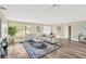 Bright living room with hardwood floors, neutral decor, and plenty of natural light at 12006 Glenshire Dr, Riverview, FL 33579