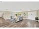 Bright living room with hardwood floors, neutral decor, and plenty of natural light at 12006 Glenshire Dr, Riverview, FL 33579