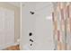 Clean shower featuring a white tile surround, and modern shower head at 12006 Glenshire Dr, Riverview, FL 33579