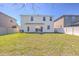 Spacious, green backyard with a patio set, perfect for outdoor gatherings and relaxation at 1218 Halapa Way, Trinity, FL 34655