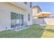 Backyard featuring a patio area, outdoor chairs, and a table, perfect for enjoying the outdoors at 1218 Halapa Way, Trinity, FL 34655