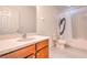 Bathroom featuring vanity, sink and white toilet and shower with tub at 1218 Halapa Way, Trinity, FL 34655