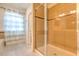 Modern tiled shower provides style and functionality to this Primary bathroom at 1218 Halapa Way, Trinity, FL 34655