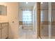 Bright bathroom featuring a soaking tub, tiled shower, and dual sink vanity for added convenience at 1218 Halapa Way, Trinity, FL 34655