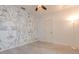 Light filled bedroom featuring artistic wall mural, wood-look floors and ceiling fan at 1218 Halapa Way, Trinity, FL 34655