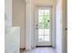 Rear door with window panes provides access to the backyard at 1218 Halapa Way, Trinity, FL 34655
