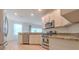 Well-equipped kitchen featuring stainless steel appliances and granite countertops at 1218 Halapa Way, Trinity, FL 34655