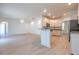 Open concept living room adjacent to the kitchen with modern flooring at 1218 Halapa Way, Trinity, FL 34655