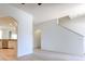 Bright, open living room featuring modern flooring, archway and staircase at 1218 Halapa Way, Trinity, FL 34655