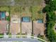 Bird's-eye view of properties with pools and outdoor features in residential community at 14239 Swiss Bridge Dr, Riverview, FL 33579