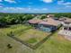 Aerial view of a fenced yard with a pool in a residential neighborhood at 14239 Swiss Bridge Dr, Riverview, FL 33579
