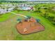 Aerial view of the community playground and surrounding grassy area at 14239 Swiss Bridge Dr, Riverview, FL 33579