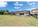 Fenced backyard featuring a screened in patio with pool and ample greenspace at 14239 Swiss Bridge Dr, Riverview, FL 33579