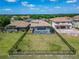 Beautiful backyard with spacious, grassy yard and screened-in pool at 14239 Swiss Bridge Dr, Riverview, FL 33579