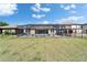 A spacious fenced backyard features a screened-in patio with a pool for outdoor enjoyment at 14239 Swiss Bridge Dr, Riverview, FL 33579