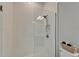 Modern bathroom showcasing a glass shower with white subway tile and sleek fixtures at 14239 Swiss Bridge Dr, Riverview, FL 33579