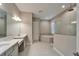 Bathroom with double vanity, soaking tub, and walk-in shower at 14239 Swiss Bridge Dr, Riverview, FL 33579