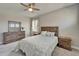 Charming bedroom with a rustic wood bed frame, plush carpet, and coordinated furniture for a serene retreat at 14239 Swiss Bridge Dr, Riverview, FL 33579