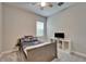 Comfortable bedroom featuring a cozy bed, natural light, and a TV stand for entertainment at 14239 Swiss Bridge Dr, Riverview, FL 33579