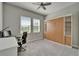 Versatile bedroom featuring a murphy bed with built-in shelving and a dedicated workspace at 14239 Swiss Bridge Dr, Riverview, FL 33579