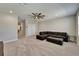 Spacious bonus room with plush carpet, recessed lighting, and a comfortable sectional sofa at 14239 Swiss Bridge Dr, Riverview, FL 33579