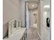 Hallway with vanity, leading to other rooms and a closet at 14239 Swiss Bridge Dr, Riverview, FL 33579