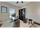 Contemporary home office featuring dark furniture, a bookcase, and a comfortable workspace setup at 14239 Swiss Bridge Dr, Riverview, FL 33579