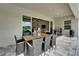 Relaxing screened lanai offers outdoor dining with views of the pool and lush backyard at 14239 Swiss Bridge Dr, Riverview, FL 33579