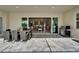 Outdoor living space with a dining area, grill, and views of the luxurious pool and spa at 14239 Swiss Bridge Dr, Riverview, FL 33579