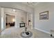 Spacious living area with stylish flooring, neutral wall color, and an open archway to other rooms at 14239 Swiss Bridge Dr, Riverview, FL 33579