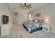 Spacious bedroom with neutral walls, ceiling fan, and access to other rooms at 14239 Swiss Bridge Dr, Riverview, FL 33579