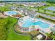 Stunning aerial view of a resort-style pool and lounge area in a beautiful residential community at 14239 Swiss Bridge Dr, Riverview, FL 33579