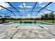 A stunning screened-in pool area with a water feature and plenty of space for outdoor lounging at 14239 Swiss Bridge Dr, Riverview, FL 33579