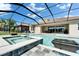 Luxury backyard pool features a spa, elegant water features, and a screened enclosure at 14239 Swiss Bridge Dr, Riverview, FL 33579