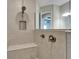 Tiled shower stall with rainfall shower head and built-in bench seating at 14239 Swiss Bridge Dr, Riverview, FL 33579