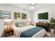 Inviting bedroom with a ceiling fan, a window view and a vintage mid-century modern aesthetic at 145 Avon Dr, Safety Harbor, FL 34695