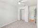 Bright bedroom featuring carpeted floors and closet space at 145 Avon Dr, Safety Harbor, FL 34695