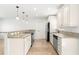 Spacious kitchen featuring modern appliances, granite countertops, and ample cabinet space for all cooking needs at 145 Avon Dr, Safety Harbor, FL 34695