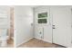 Bright laundry room with shelving and a small window at 145 Avon Dr, Safety Harbor, FL 34695
