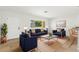 Bright living room featuring modern furniture, stylish decor, and plenty of natural light, creating a comfortable atmosphere at 145 Avon Dr, Safety Harbor, FL 34695