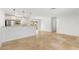 Open-concept living room and kitchen area with bright, neutral paint and tile flooring throughout at 145 Avon Dr, Safety Harbor, FL 34695