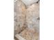 Walk-in shower with neutral-toned tiles and a mosaic tile floor at 145 Avon Dr, Safety Harbor, FL 34695