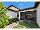 Screened-in patio with lush grass and mature landscaping in the backyard at 16927 April Plush Dr, Wimauma, FL 33598