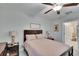 Cozy bedroom with a ceiling fan, wooden furniture, and ample natural light at 16927 April Plush Dr, Wimauma, FL 33598