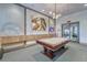 Billiards room featuring pool table, stylish lighting, decorative wall art and comfortable ambiance at 16927 April Plush Dr, Wimauma, FL 33598