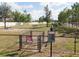 Community dog park featuring fenced areas for large and small dogs, with shade trees at 16927 April Plush Dr, Wimauma, FL 33598